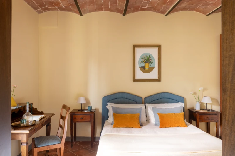 Classic room with double bed, wooden furniture and elegant headboard in Tuscan villa at Barberino Tavarnelle - Villa San Filippo, BZAR hotels in Tuscany