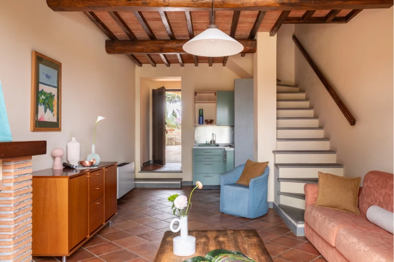 Family room with living area, internal staircase and kitchenette in Tuscan style at Barberino Tavarnelle in Chianti - Villa San Filippo, BZAR hotels in Tuscany