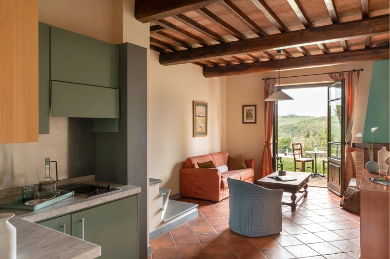 Family room with equipped kitchen, living area and garden access overlooking Tuscan countryside in Barberino Tavarnelle - Villa San Filippo, BZAR hotels in Tuscany