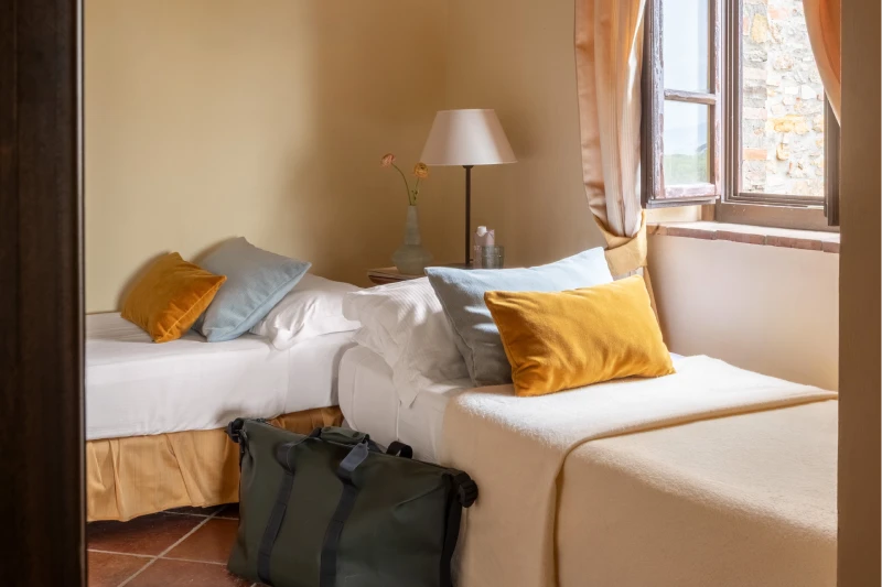 Family room with multiple beds and spacious layout ideal for families in Tuscan countryside at Barberino Tavarnelle - Villa San Filippo, BZAR hotels in Tuscany