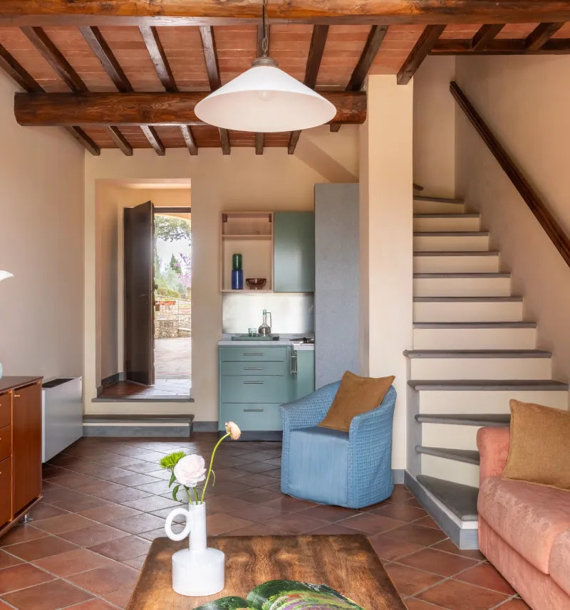 Family room with living area, internal staircase and kitchenette in Tuscan style at Barberino Tavarnelle in Chianti - Villa San Filippo, BZAR hotels in Tuscany